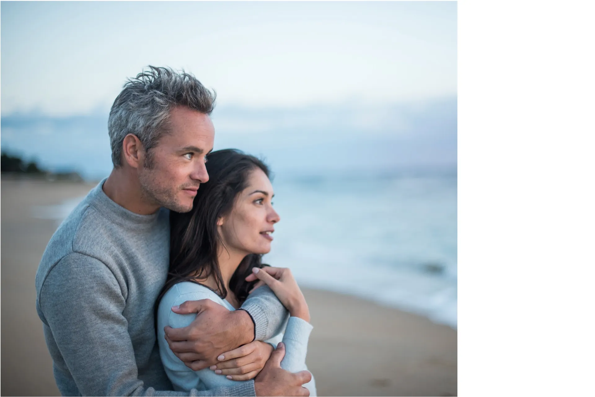 Couple embracing on beach representing restored desire with PT-141 at Rewind Anti-Aging Miami