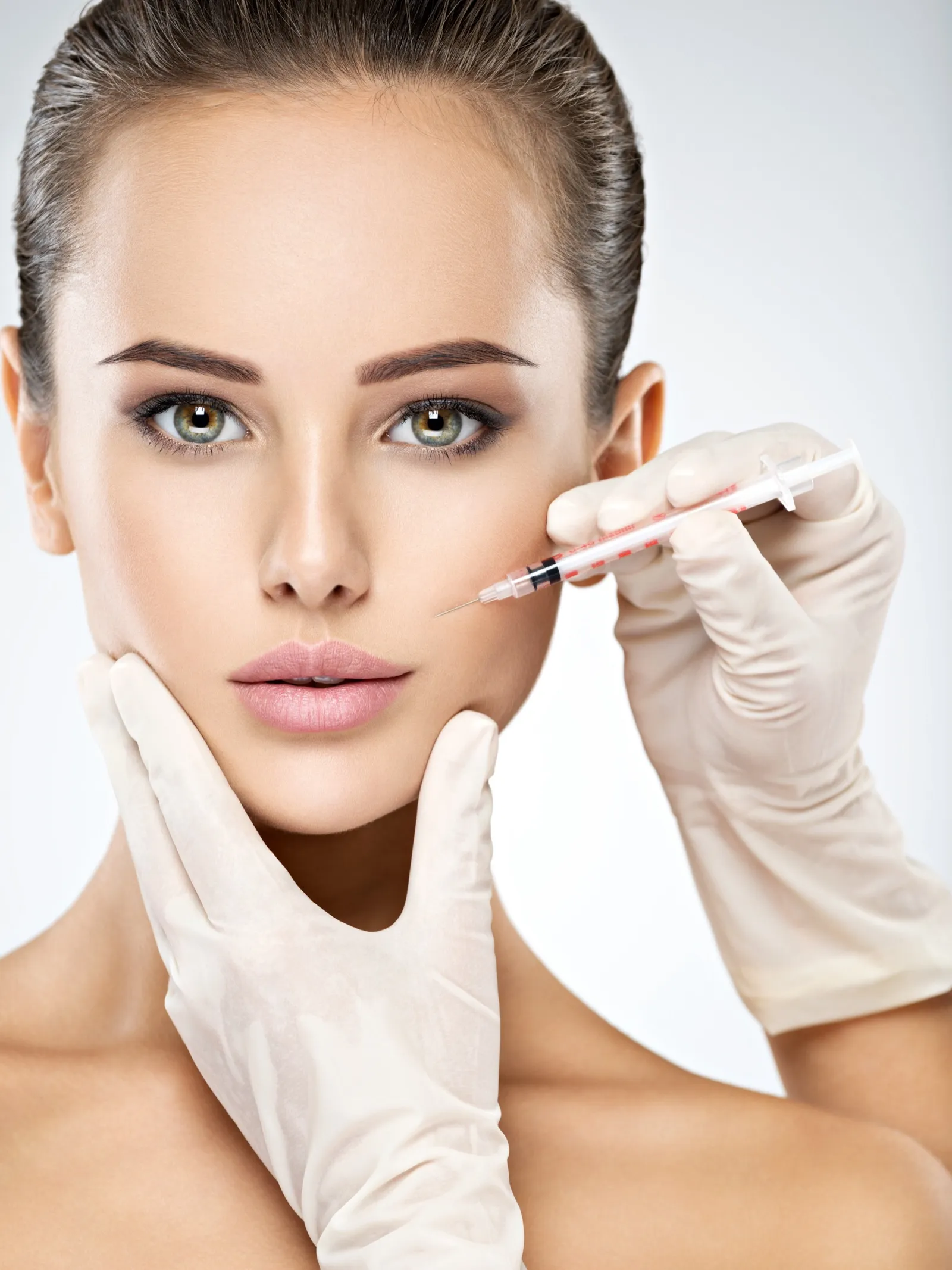 Cheek filler injection representing expert Restylane dermal filler treatments at Rewind Anti-Aging Miami