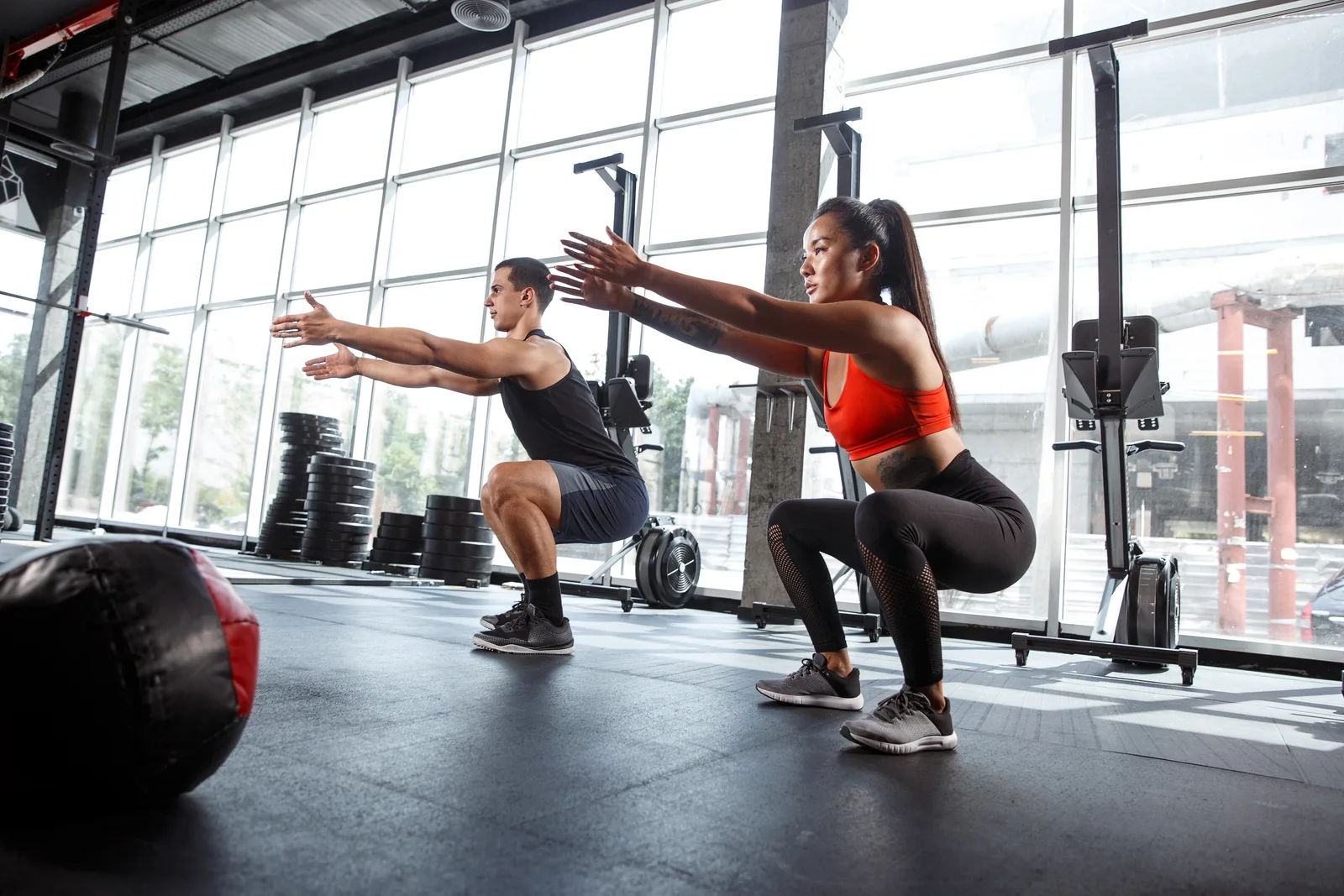 Career-peak Fort Lauderdale couple training in the gym — hormone and body composition care