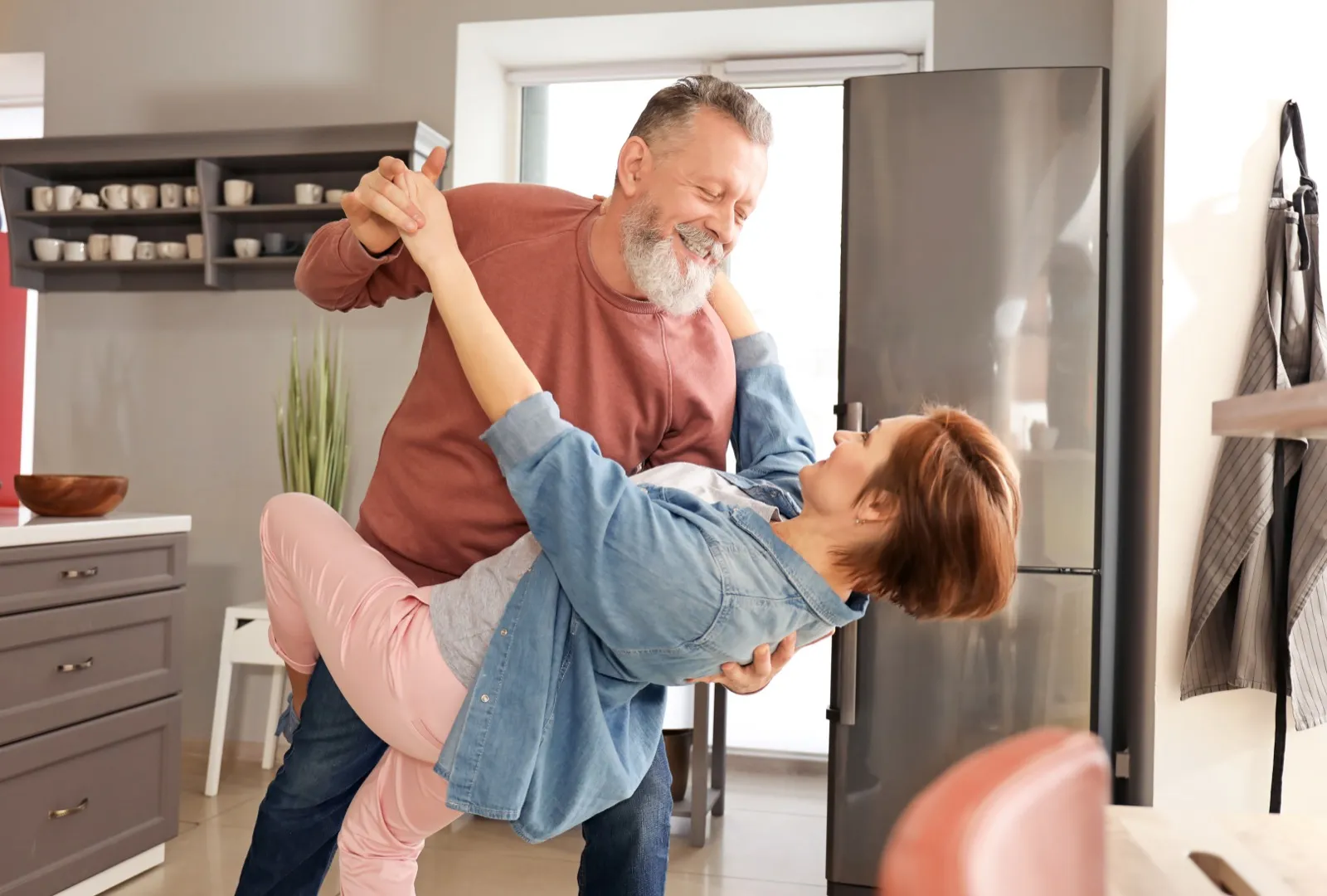 Playful couple with renewed energy and vitality from female sexual health treatment at Rewind Anti-Aging Miami
