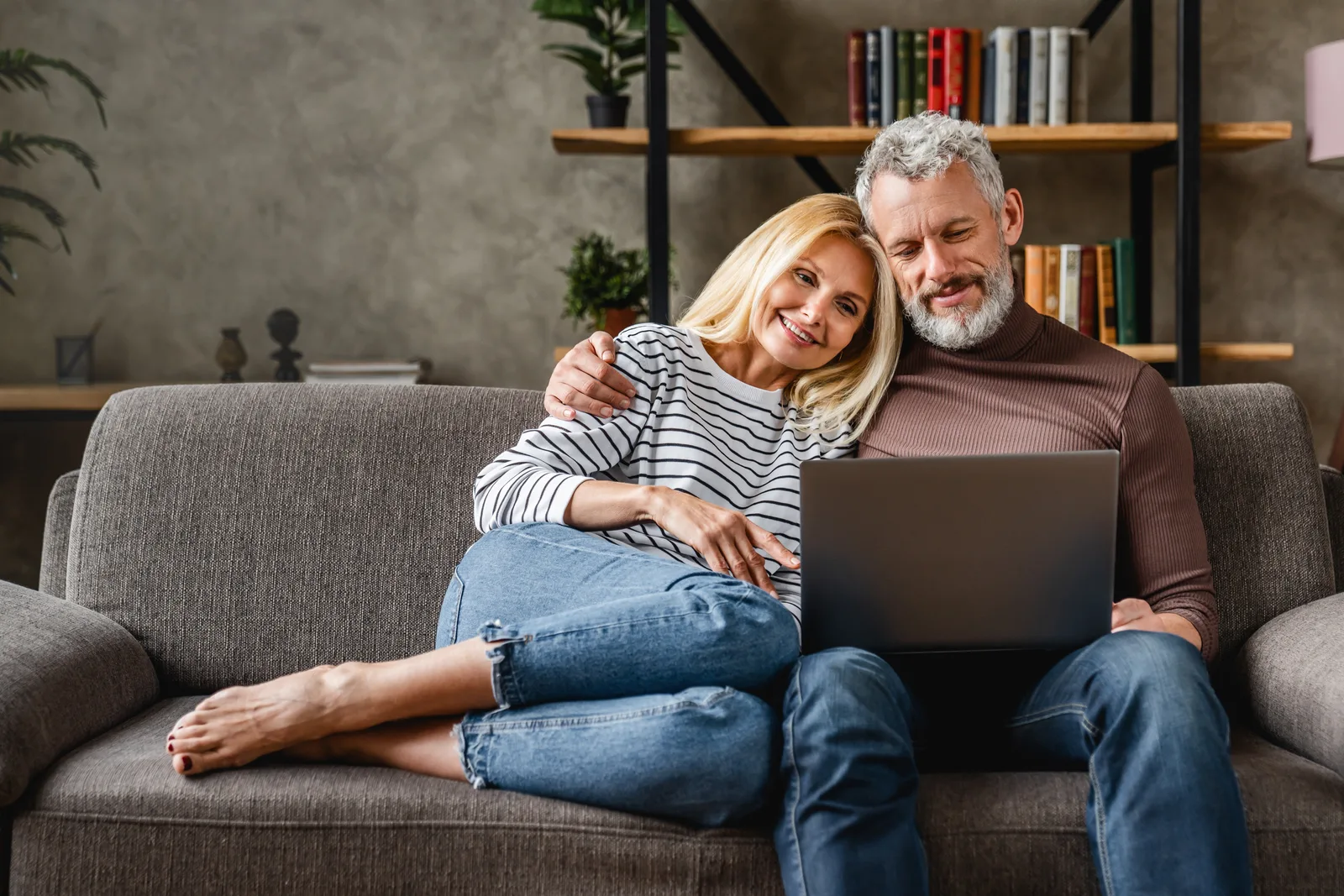 Mature Aventura couple at home — integrated aesthetic, peptide, and hormone care for the corridor